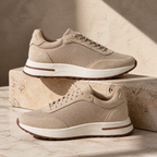 Bruce & Co Orvessa beige sneakers on travertine