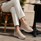 Bruce & Co Orvessa beige sneakers at a European cafe