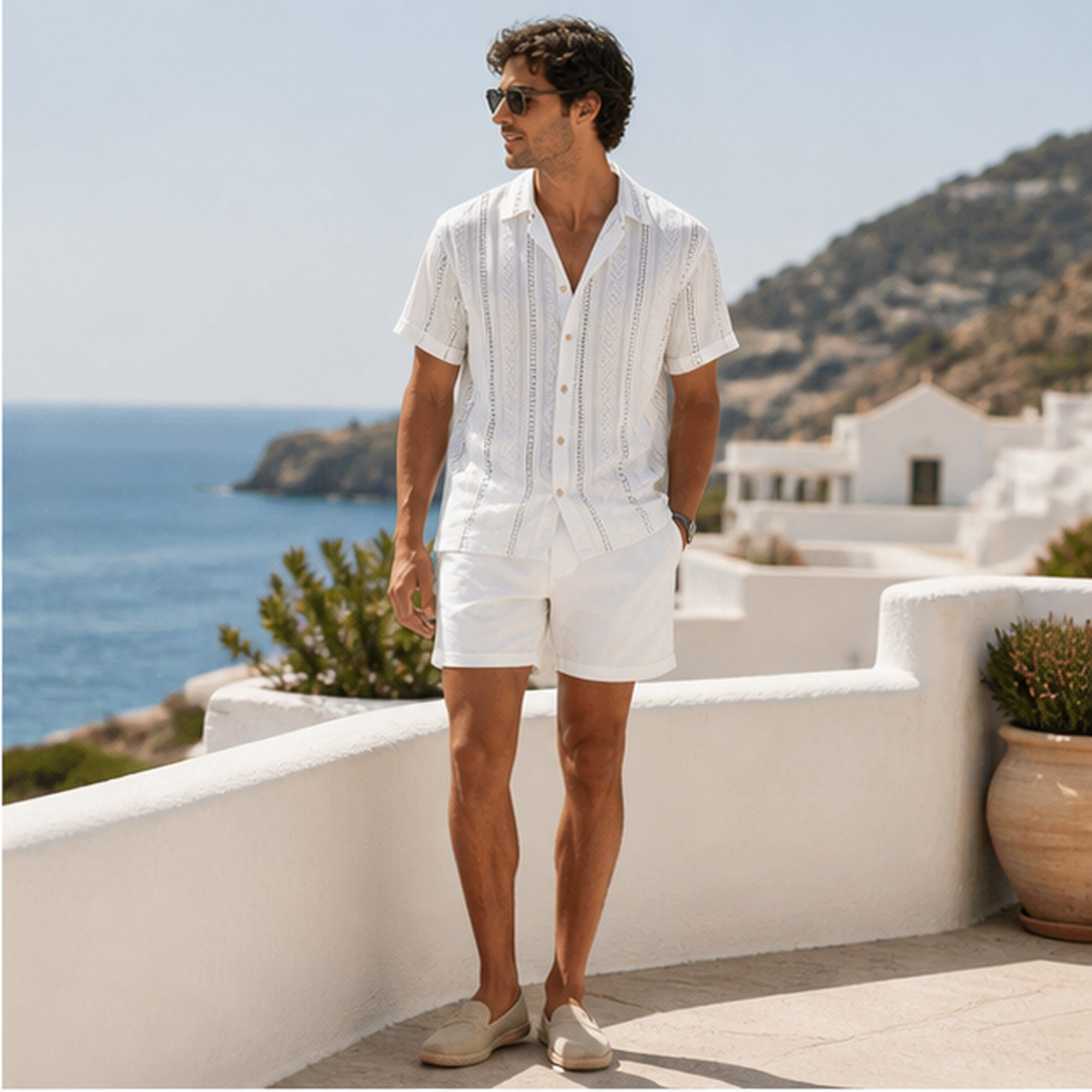 Palelian white shirt and white shorts styled on a sea-view terrace