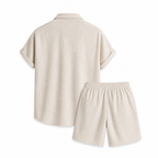 Rear view of the Palevane beige ribbed shirt and shorts set on white