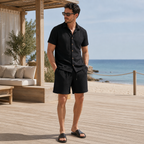 Man wearing the Palevane black set at a coastal beach club