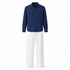 Quinmere navy shirt and white trousers set on a white studio background