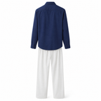 Rear view of the Quinmere navy shirt and white trousers set on white