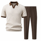 Quinvane beige textured Johnny-collar polo and brown tapered trousers, studio front