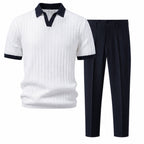 Quinvane white and navy textured Johnny-collar polo with navy tapered trousers, studio front