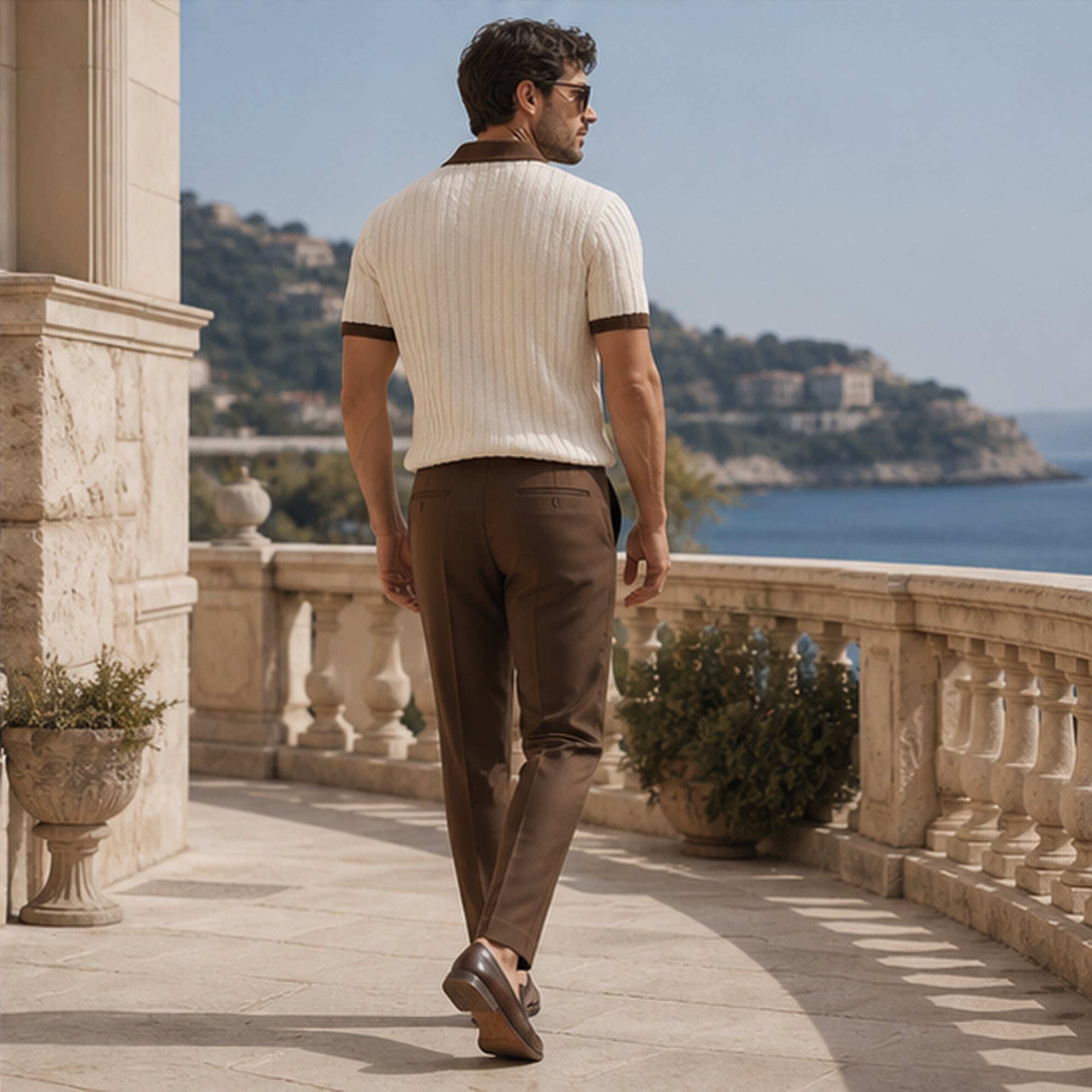 Quinvane beige set rear walking view on a coastal terrace