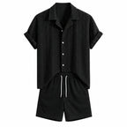Rovemere black geometric jacquard Cuban shirt and black crinkle shorts, studio front