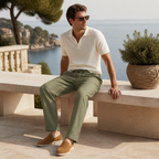Selvaro olive linen trousers styled on a coastal terrace