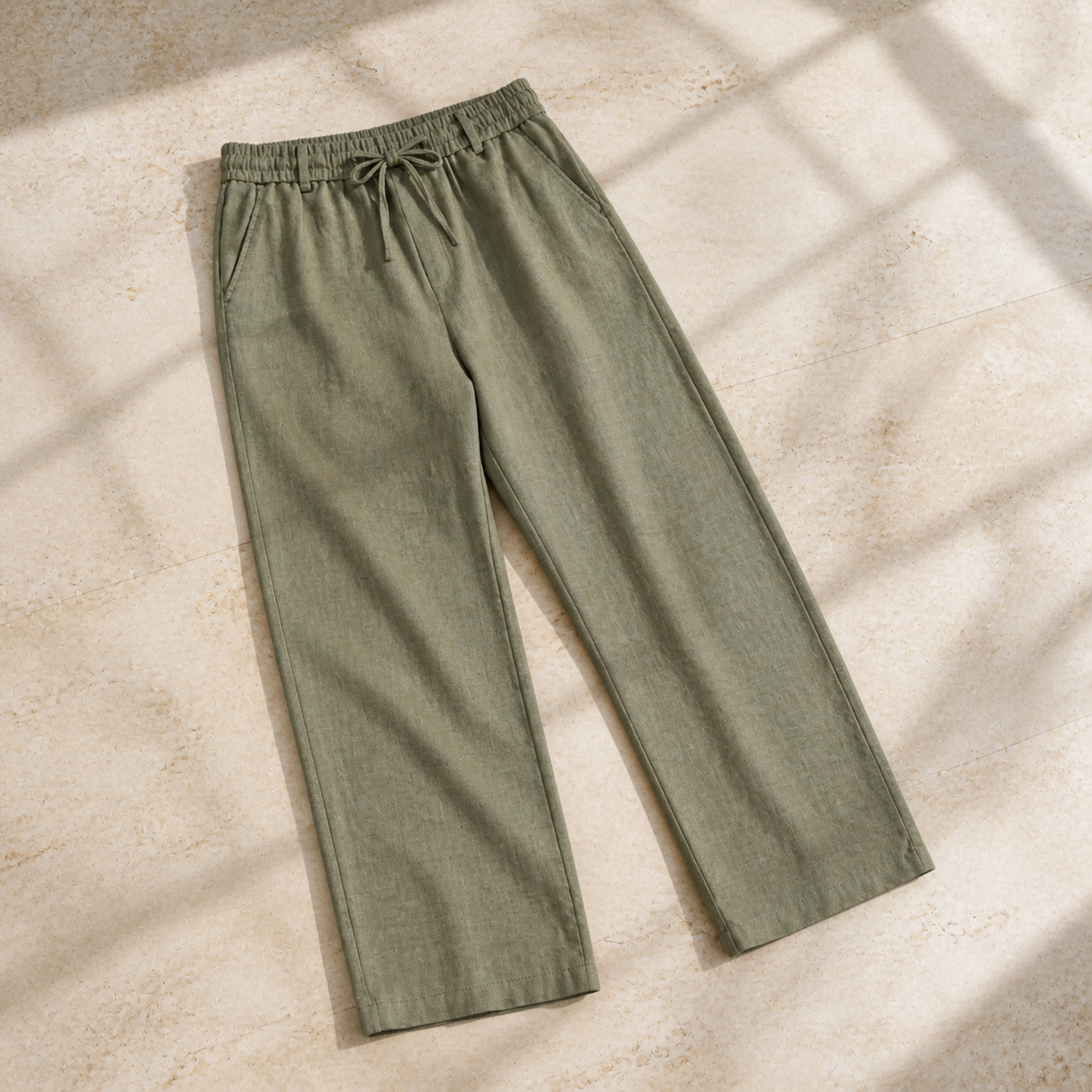 Selvaro olive linen trousers, premium travertine flat lay