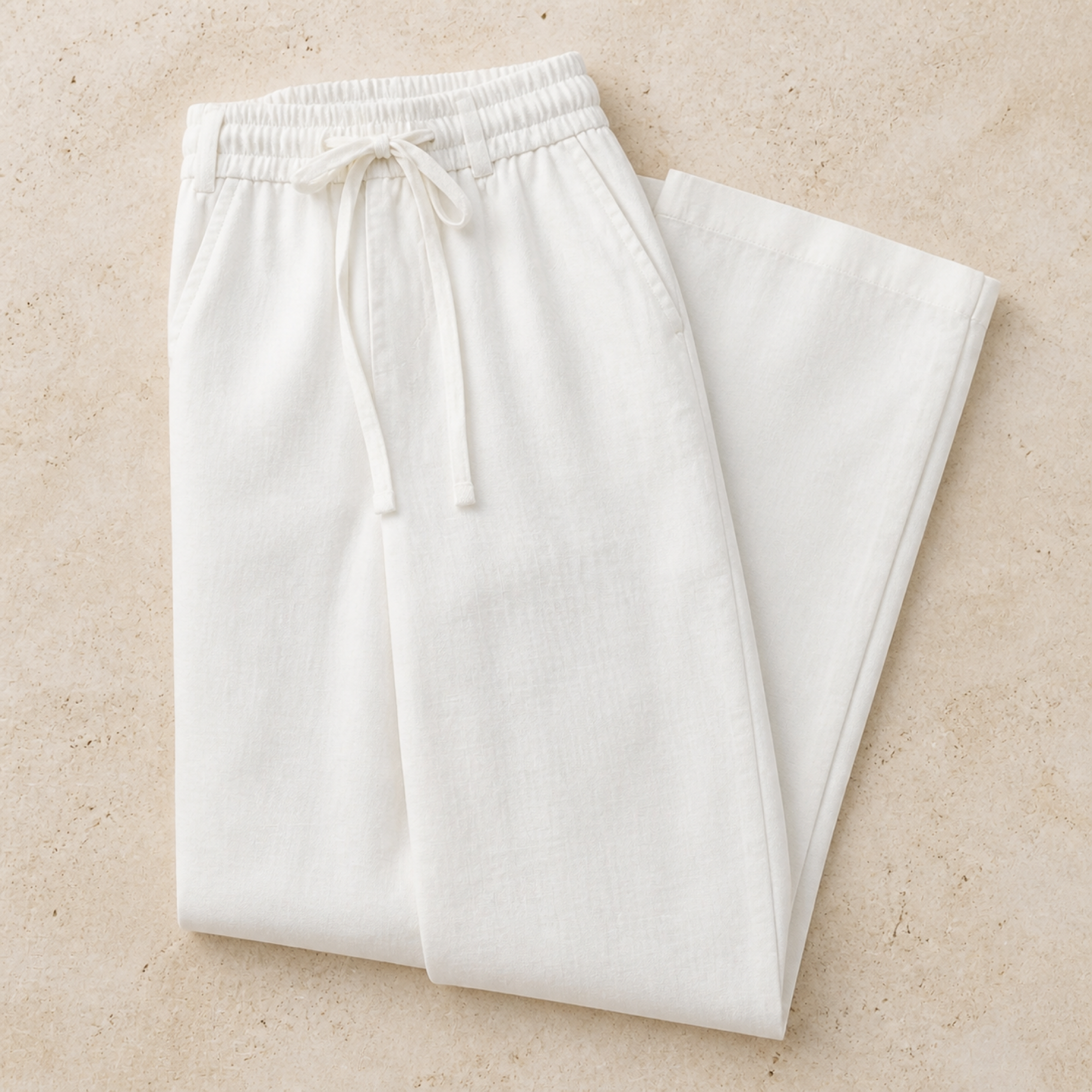 Selvaro white linen trousers folded editorial
