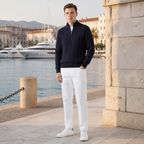 Man wearing the Seresaro outfit on a Mediterranean marina promenade