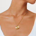 Bruce & Co Nalu – Spiral Disc Pendant Necklace, 19 mm, Gold PVD Steel