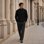 Man wearing the black Taverino sweater on a European colonnade