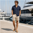 Tavesaro men's navy shirt and beige shorts set at a marina
