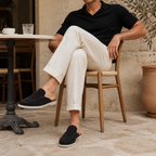 Bruce & Co Vellaro black open-back loafers styled at a Mediterranean cafe