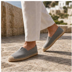 Grey Wynmont canvas espadrilles worn on a Mediterranean stone terrace