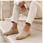 Beige Wynmont canvas espadrilles worn on limestone steps