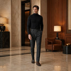 Wynvane charcoal pleated trousers styled in a luxury hotel