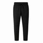 Black Xaverel men's linen drawstring trousers on a pure white studio background