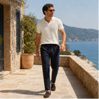 Navy Xaverel linen trousers styled on a Mediterranean terrace