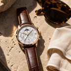 Xavevaro watch styled on travertine with sunglasses and linen