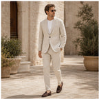 Beige Yorevaro linen suit styled in a Mediterranean courtyard