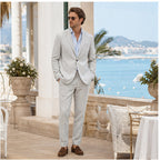 Grey Yorevaro linen suit styled on a coastal hotel terrace