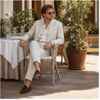 Beige Yorevaro linen suit styled at a refined outdoor restaurant