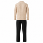 Rear view of the Zaledane ecru sweater and black trousers on pure white